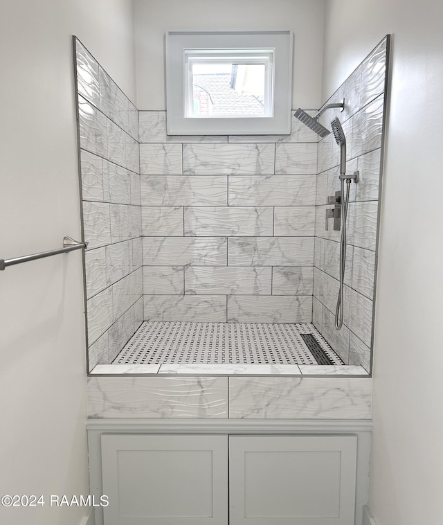 full bath with tiled shower