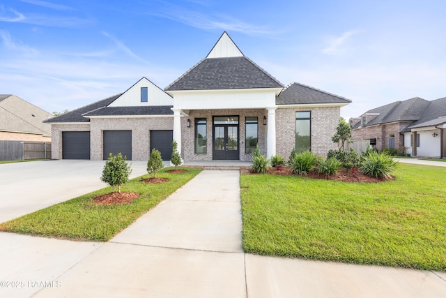 view of front facade featuring a shingled roof, concrete driveway, an attached garage, french doors, and a front yard