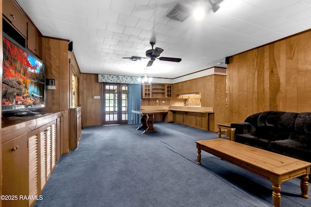 617 Cemetery Rd, Saint Martinville, LA 70582 - living area featuring wood walls, french doors, carpet flooring, and ceiling fan