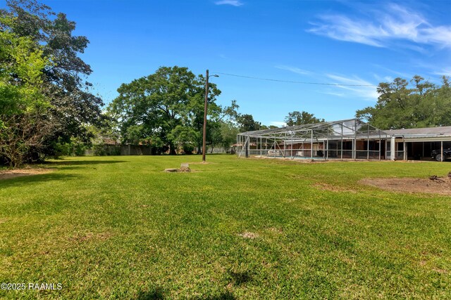 617 Cemetery Rd, Saint Martinville, LA 70582 - view of grassy yard featuring a lanai