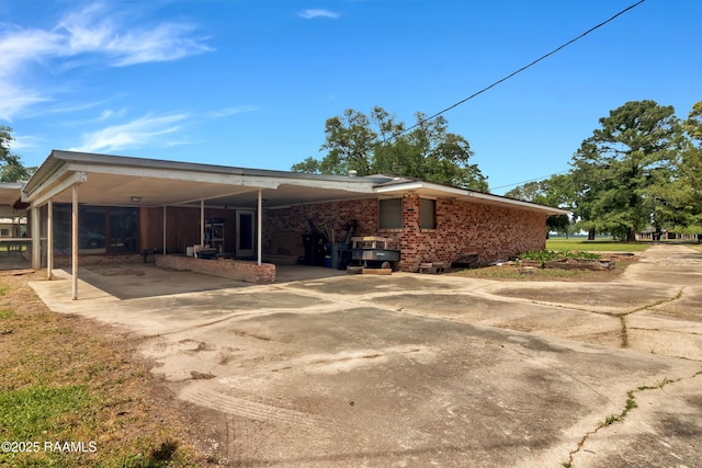 617 Cemetery Rd, Saint Martinville, LA 70582 - view of side of home with concrete driveway and an attached carport