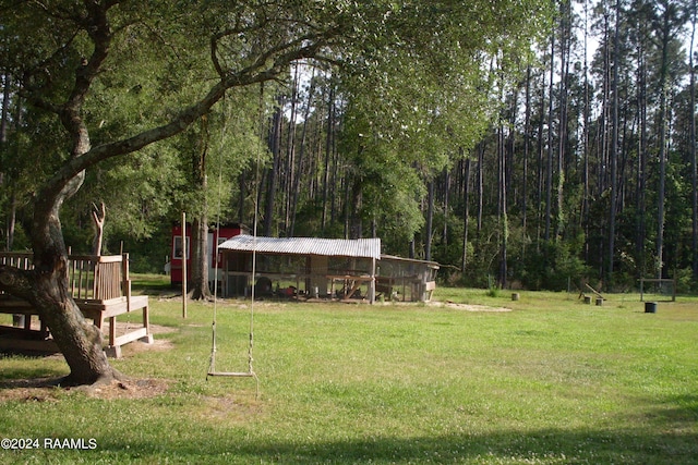 view of property's community with a lawn