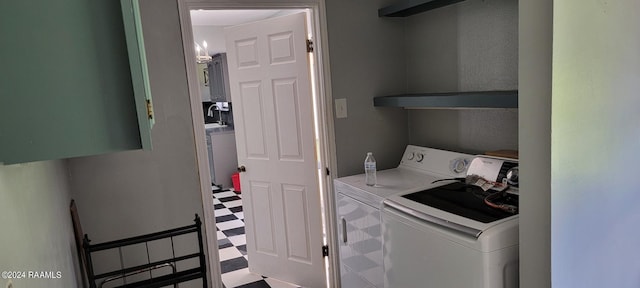 washroom with washer and clothes dryer, sink, and tile floors