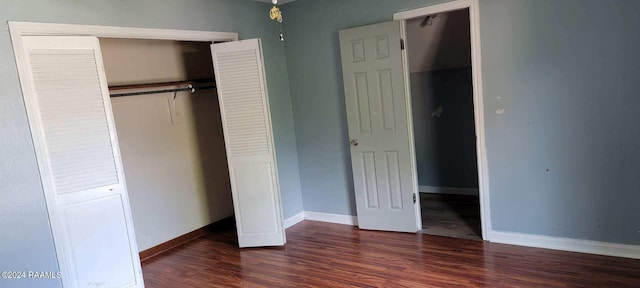 unfurnished bedroom featuring dark wood-type flooring