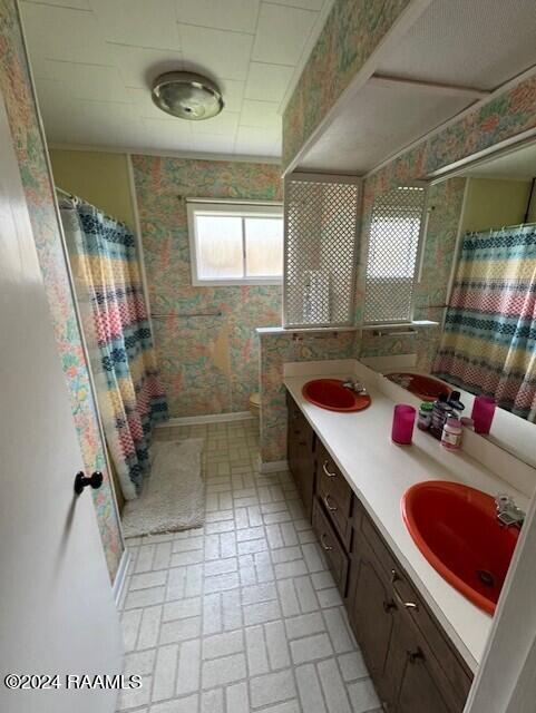 bathroom with vanity and walk in shower