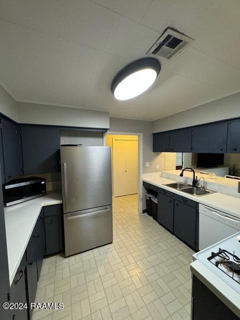 kitchen featuring stainless steel appliances and sink