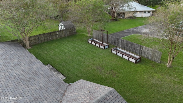 exterior space with a yard and a shed