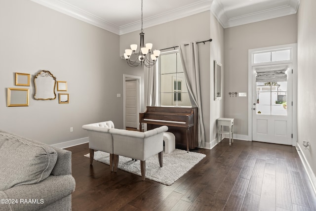 dining space featuring dark hardwood / wood-style floors, crown molding, and a chandelier