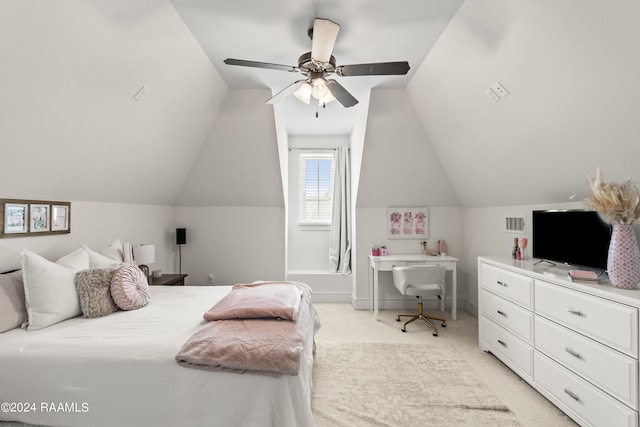 bedroom featuring light colored carpet, lofted ceiling, and ceiling fan