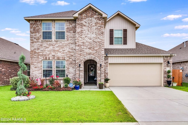 view of front facade with a garage and a front yard