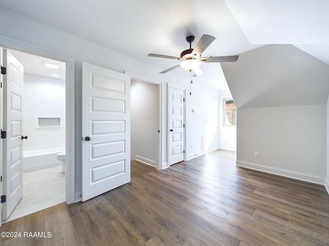 bonus room featuring vaulted ceiling, ceiling fan, and dark hardwood / wood-style floors