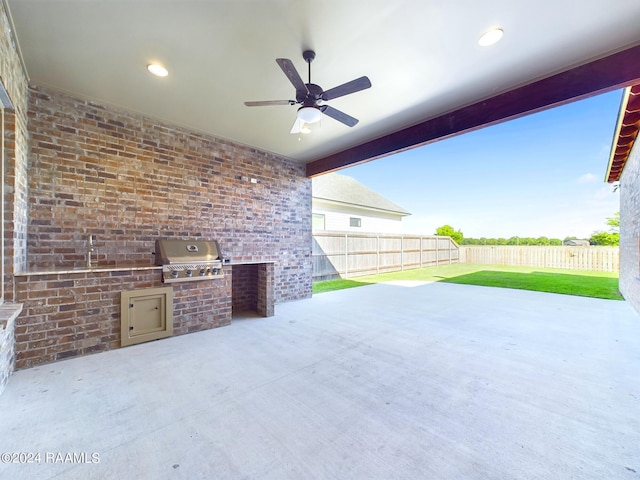 view of patio / terrace with area for grilling and ceiling fan