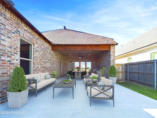 view of patio / terrace with an outdoor living space and ceiling fan