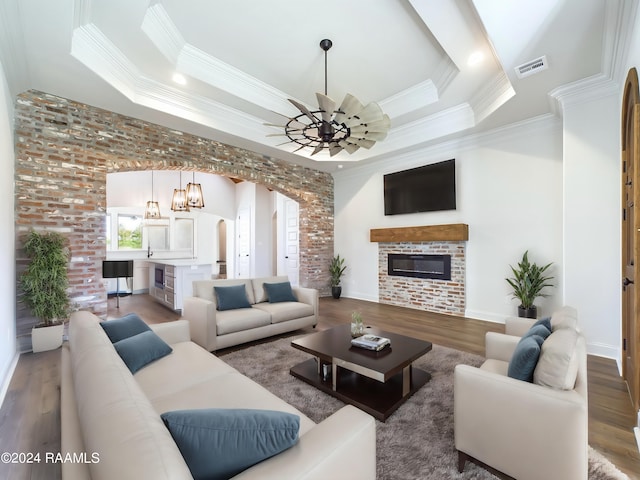 living room featuring hardwood / wood-style floors and ornamental molding