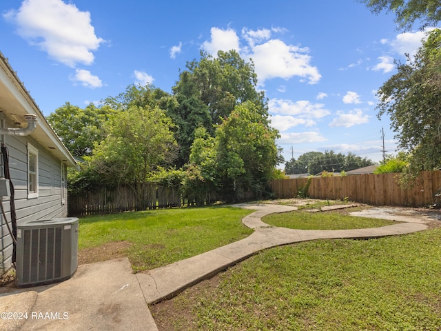 view of yard featuring central AC unit