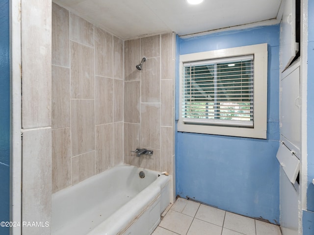 bathroom featuring tiled shower / bath and tile flooring