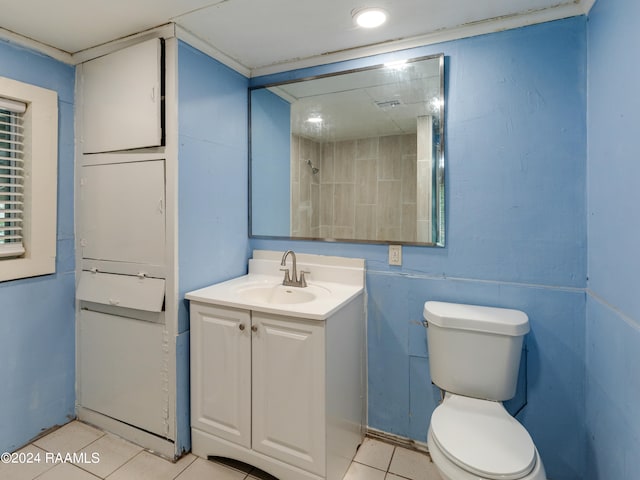 bathroom featuring tile floors, large vanity, and toilet