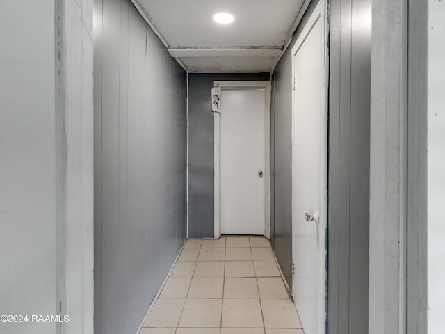 corridor featuring light tile floors