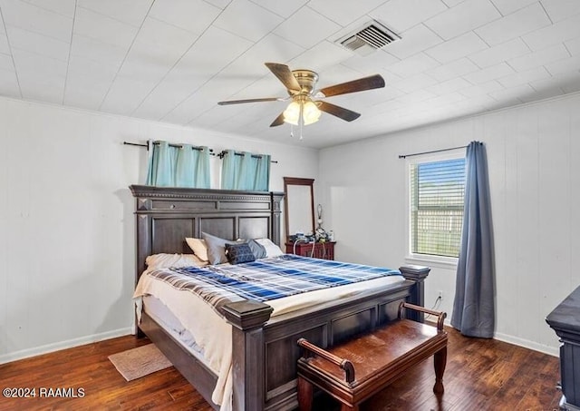 bedroom with dark wood-type flooring and ceiling fan