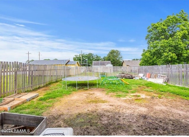 view of yard with a trampoline