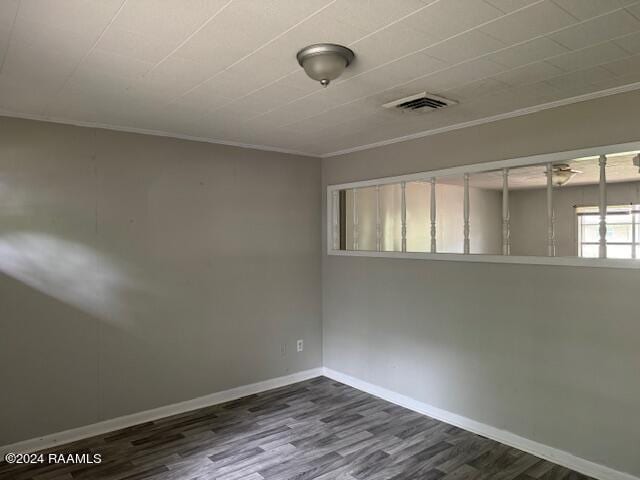 123 Lester St, Ville Platte, LA 70586 - spare room with crown molding and dark hardwood / wood-style floors