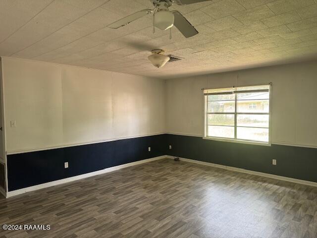 123 Lester St, Ville Platte, LA 70586 - unfurnished room with ceiling fan and dark hardwood / wood-style floors