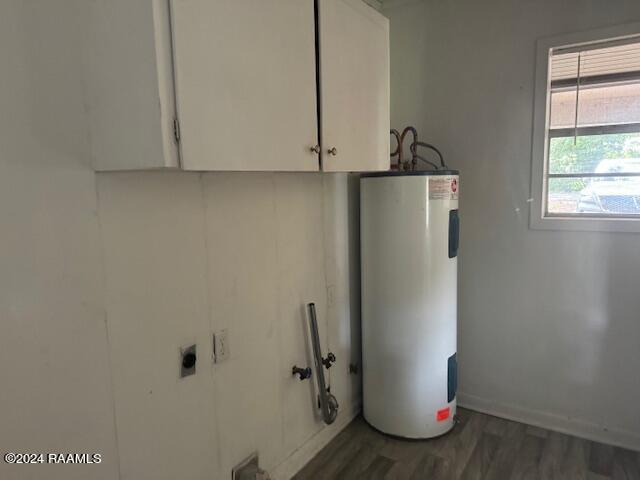123 Lester St, Ville Platte, LA 70586 - utility room featuring electric water heater