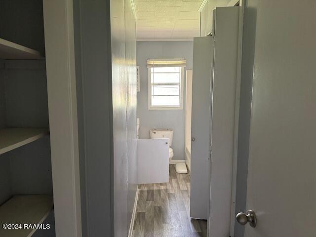123 Lester St, Ville Platte, LA 70586 - bathroom with toilet and hardwood / wood-style floors