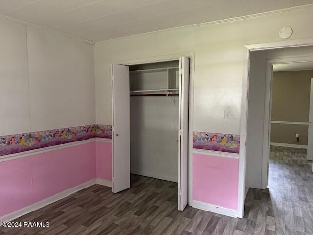 123 Lester St, Ville Platte, LA 70586 - bedroom with dark hardwood / wood-style flooring and a closet