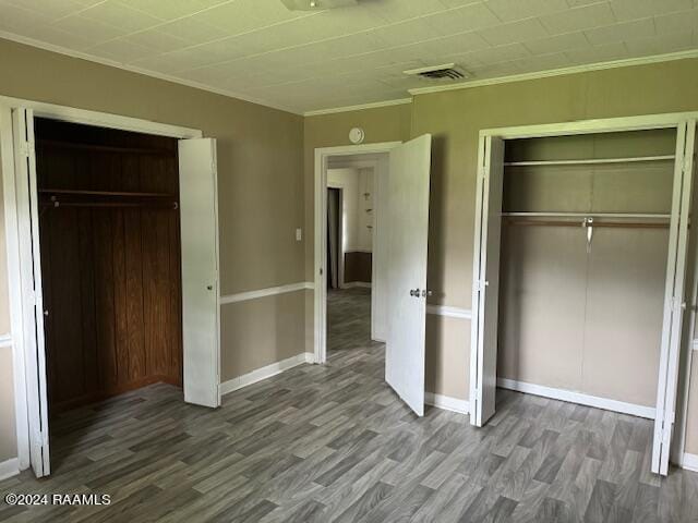 123 Lester St, Ville Platte, LA 70586 - unfurnished bedroom with ornamental molding, a closet, and hardwood / wood-style floors