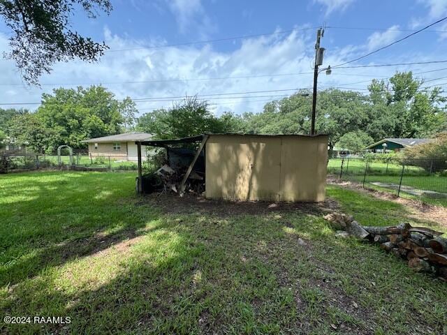 123 Lester St, Ville Platte, LA 70586 - view of outbuilding featuring a yard