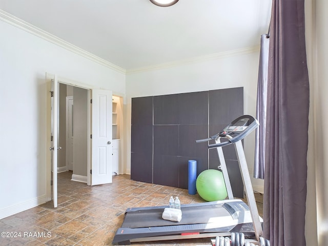 workout area featuring ornamental molding