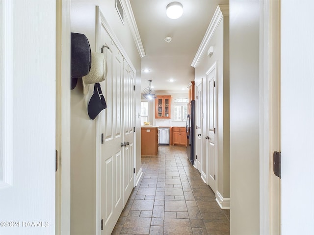 corridor featuring crown molding