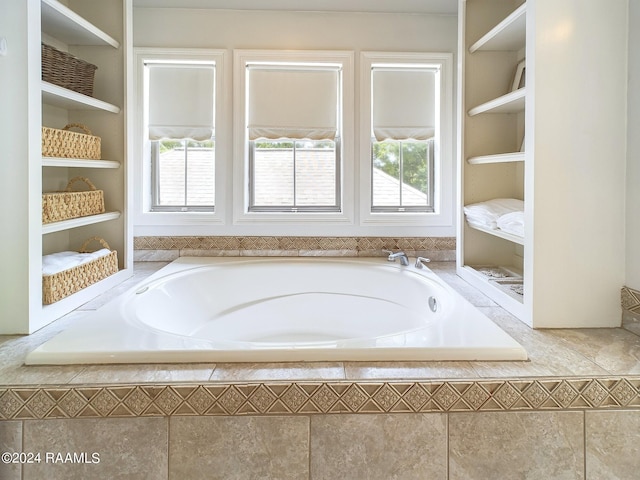 bathroom featuring tiled bath