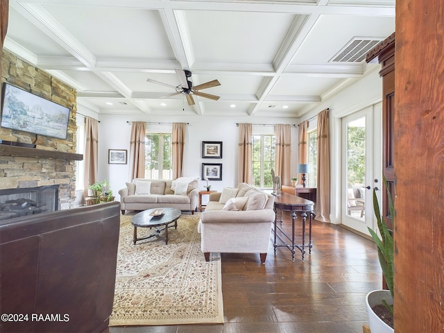 living room with beam ceiling, dark hardwood / wood-style flooring, plenty of natural light, and coffered ceiling