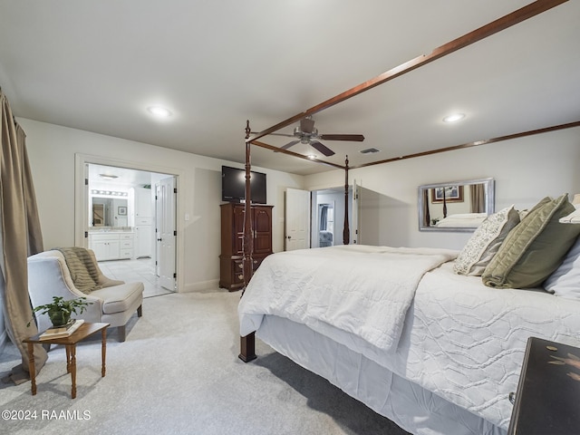 bedroom featuring ceiling fan, crown molding, light colored carpet, and ensuite bathroom