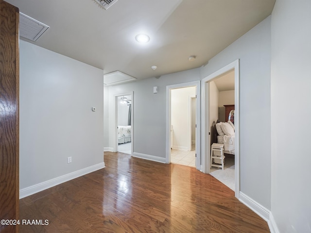 empty room with dark hardwood / wood-style flooring