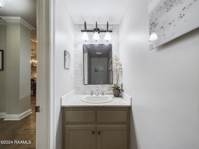 bathroom featuring vanity and tasteful backsplash