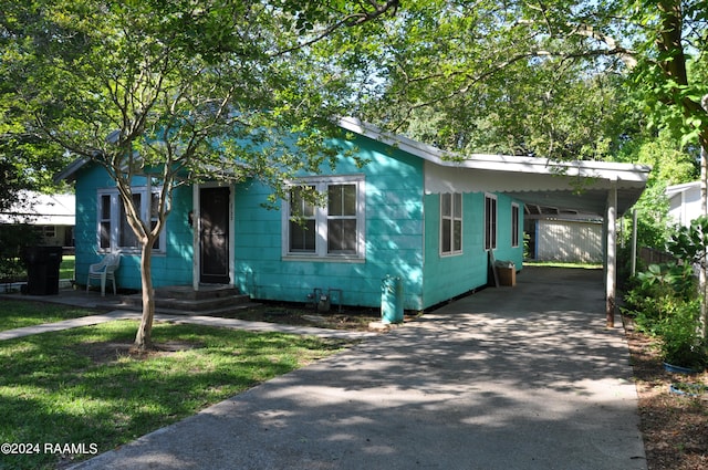 bungalow-style house with a carport