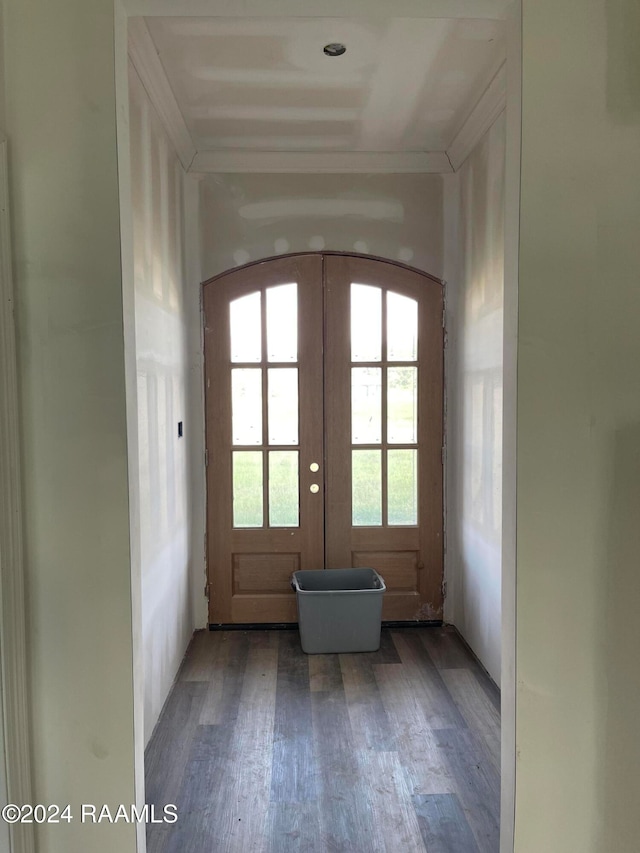 entryway with hardwood / wood-style flooring, french doors, and crown molding