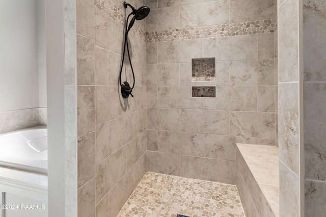 bathroom with separate shower and tub