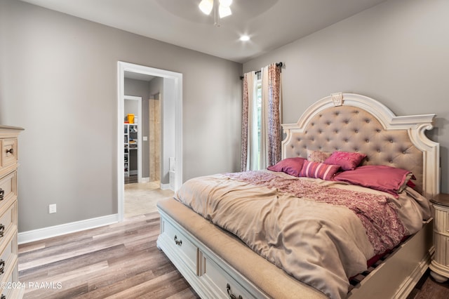 bedroom featuring ceiling fan and light hardwood / wood-style flooring