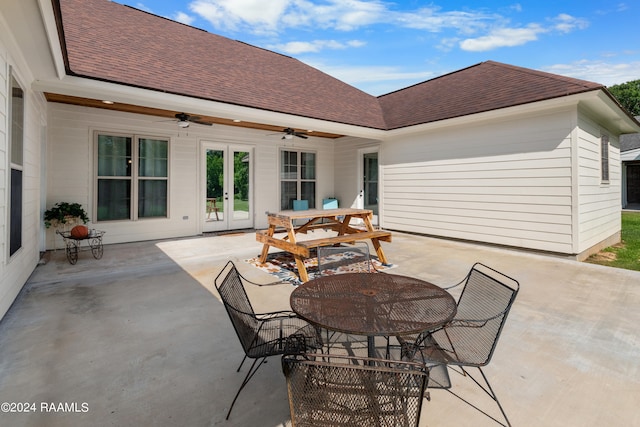 view of terrace with ceiling fan and french doors