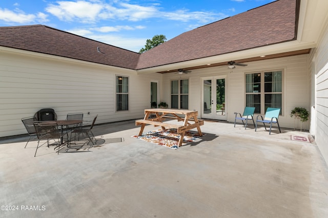 view of terrace with ceiling fan and french doors