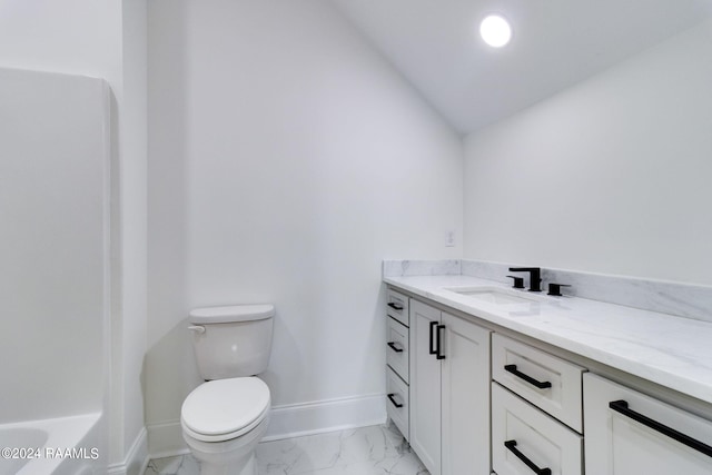 bathroom featuring tile floors, lofted ceiling, toilet, and vanity