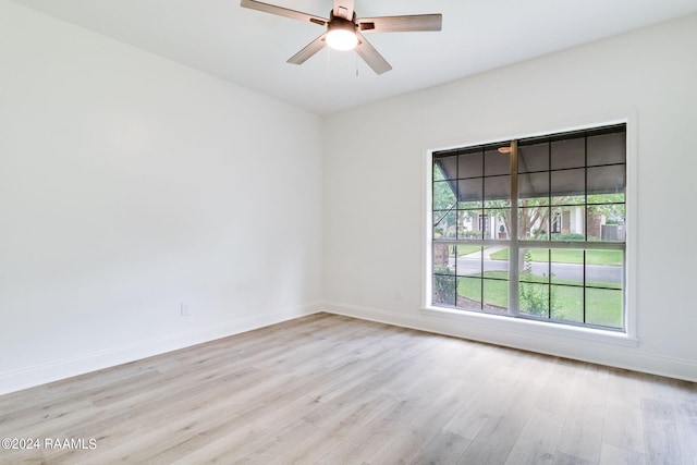 unfurnished room featuring ceiling fan and light hardwood / wood-style floors