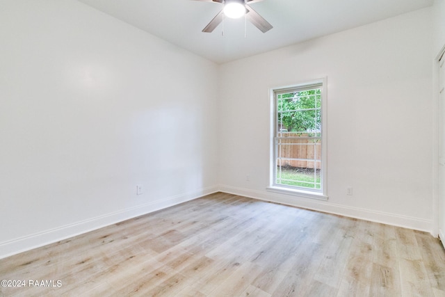 spare room featuring ceiling fan and light wood-type flooring