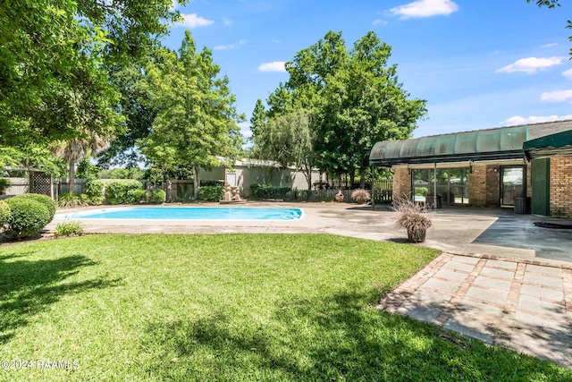 view of yard with a patio and a fenced in pool