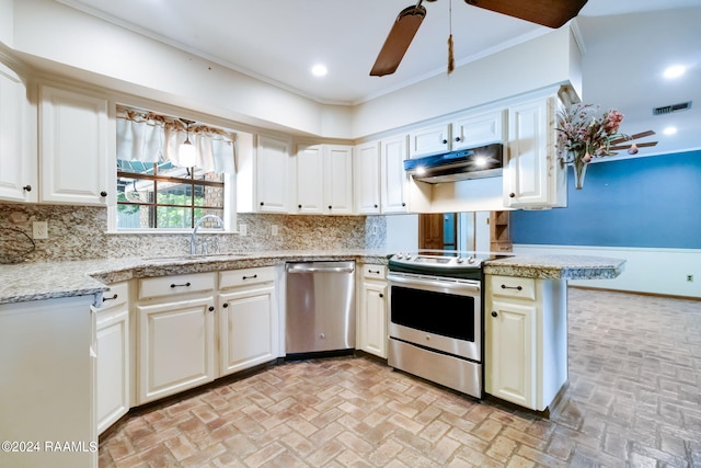 kitchen featuring ceiling fan, tasteful backsplash, sink, white cabinets, and appliances with stainless steel finishes