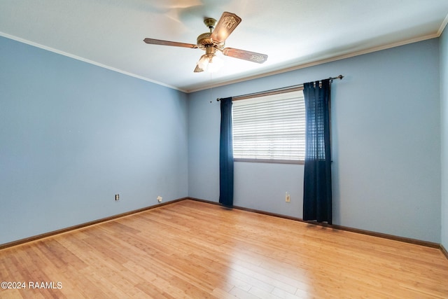 spare room with ornamental molding, wood-type flooring, and ceiling fan